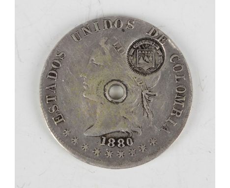 A 19th century Costa Rica counterstamped emergency coin, the host coin being a Columbia fifty centavos 1880.Buyer’s Premium 2