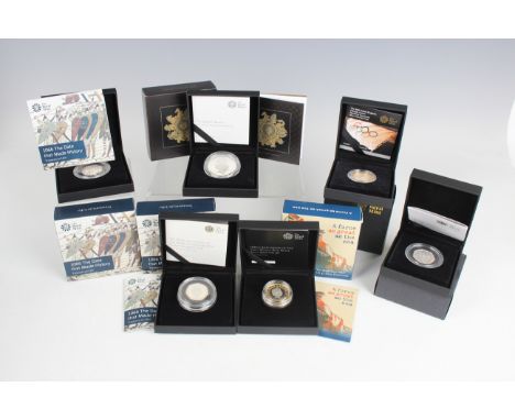 A collection of Royal Mint deluxe-cased silver commemorative coins, including two 950th Anniversary of the Battle of Hastings