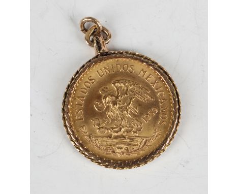 A Mexico twenty pesos 1959 within a 14ct gold ropewtist pendant mount.Buyer’s Premium 29.4% (including VAT @ 20%) of the hamm