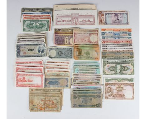 A collection of 20th century British and world banknotes, including Thailand, Japan, Hong Kong, Iraq, Bolivia and Oman.Buyer’