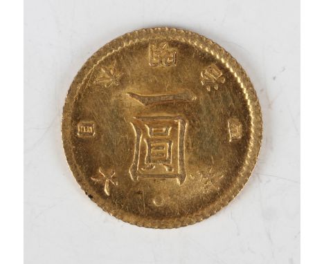 A Japanese gold one yen 1871, reverse with sunburst crest, superimposed over the sacred mirror, surrounded by military banner