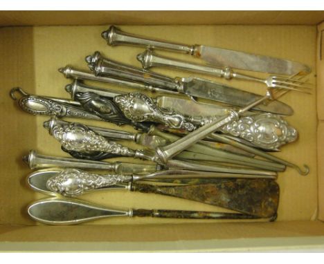 Silver handled glove stretchers, silver handled cutlery, button hooks, etc.