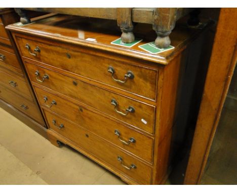 A Georgian mahogany chest of 4 long drawers on bracket feet.