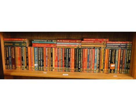 A shelf of paperback books.