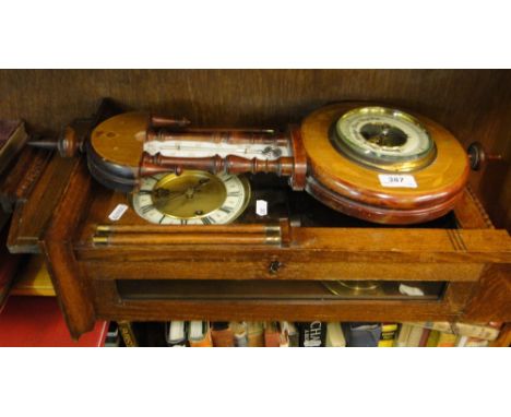 A barometer and an oak wall clock.