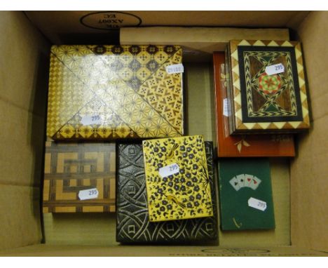 Various decorative boxes and a print block and a cards tin.
