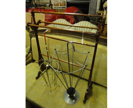 A mahogany towel rail and 2 umbrella stick stands.