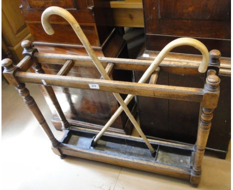 An Edwardian mahogany stick stand.