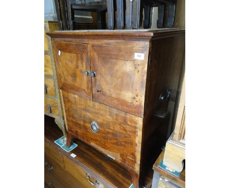 A Georgian mahogany small cabinet with cupboard and drawer on bracket feet.
