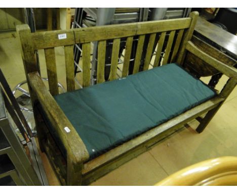 A weathered slatted garden bench.