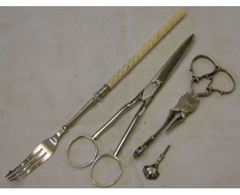 A pair of silver scissors, c. 1890,an ivory & silver pickle fork, & pair of silver sugar nips (damaged) (3)