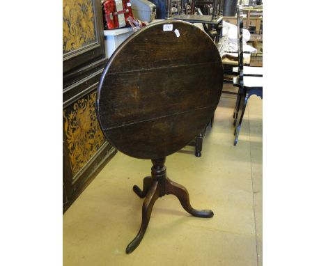 A George III oak tilt top tripod table.