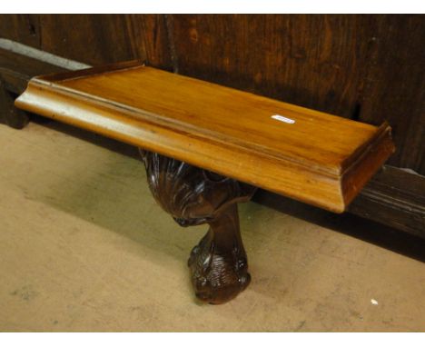 A mahogany wall bracket.