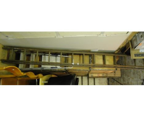 A Vintage pine 14 rung double extending ladder.
