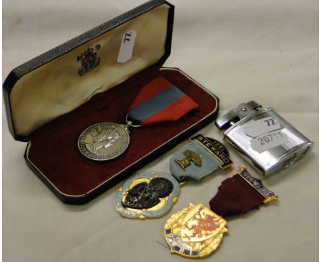 A Ronson lighter, Masonic enamelled badges and a medal.