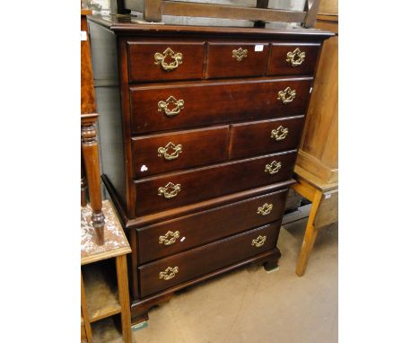 An American cherrywood tall boy on bracket feet.