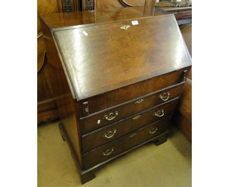 A Georgian style mahogany 3 drawer bureau on bracket feet.