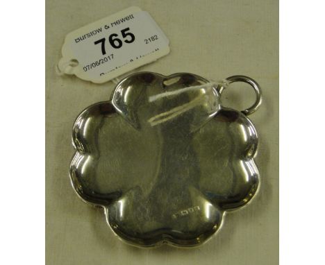 A small silver shaped pin dish by Cartier of London.