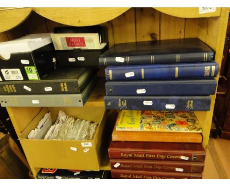 2 Shelves of albums of postage stamps including First Day Covers and International Collections.