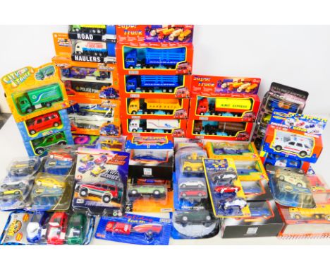 Maisto - Teamsterz - A collection of boxed and carded vehicles including Ford Explorer, Audi R8, Mercedes A Class and others.