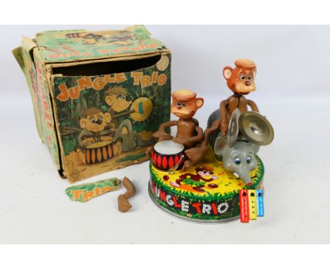 Linemar Toys - A boxed Battery Operated Jungle Trio (J-4792) Item shows signs of use and age; 1 monkey has a detached leg (pr