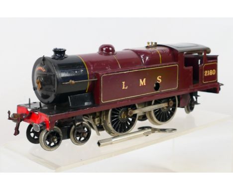 Hornby - An unboxed O gauge clockwork 4-4-2 2180 LMS locomotive. Item appear to be in good-very good condition with its clock