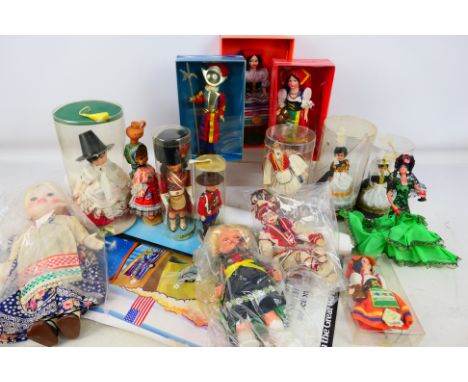 Dolls - An assortment of approx 15 costume dolls of different nationalities, together with a roll of vintage posters includin