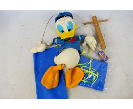 Pelham Puppets - An unboxed Disney Donald Duck marionette puppet with some additional felt material. Item appears to be in ve