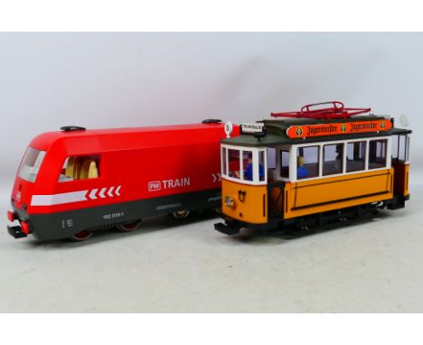 Lehmann - Playmobil - A pair of unboxed G gauge powered models to include a L.G.B. Yellow German tramcar and a red Playmobil 