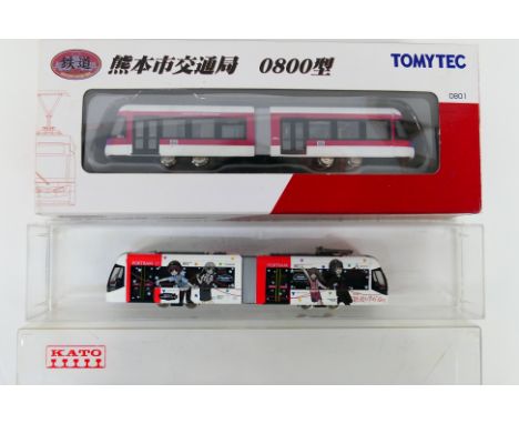 TomyTec - A pair of N gauge City trams to include #0801 red and white and a Porttram red and white. Items appear to be in ver