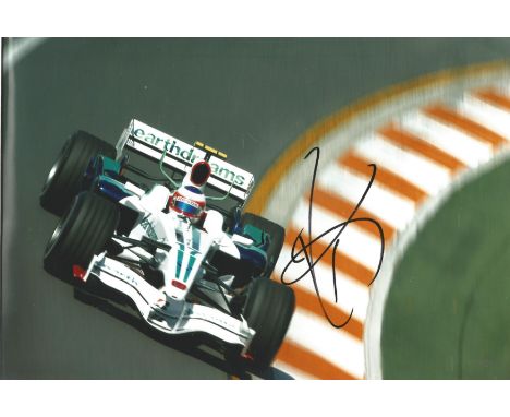 Motor Racing Jenson Button 8x12 signed colour photo pictured during his World championship winning year 2009 with Brawn. Good