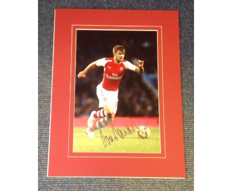 Football Aaron Ramsey signed 16x12 mounted colour photo pictured in action for Arsenal. Good Condition. All signed pieces com