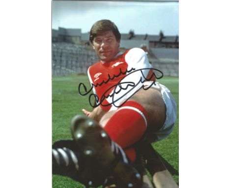 Football Malcolm Macdonald 12x8 signed colour photo pictured in Arsenal kit. Good Condition. All signed pieces come with a Ce