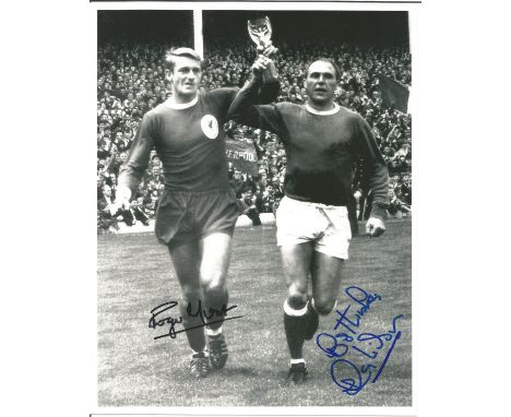 World Cup Winners 1966 Roger Hunt and Ray Wilson signed 10x8 b/w photo pictured parading the Jules Rimet Trophy before the Me