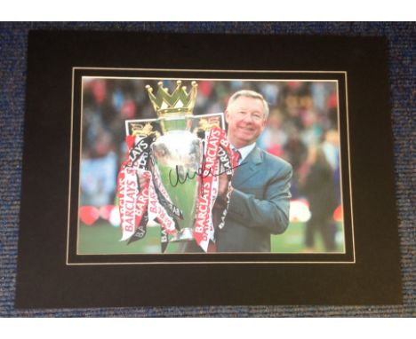 Football Alex Ferguson signed 16x12 mounted colour photo pictured with the premier league trophy. Good Condition. All signed 