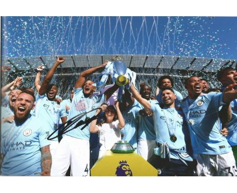 Football Vincent Kompany 8x12 signed colour photo pictured celebrating with Premier league trophy. Good Condition. All signed