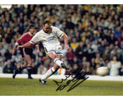 Football Autographed MEL STERLAND photo, a superb image depicting Sterland scoring Leeds United's goal from the penalty spot 