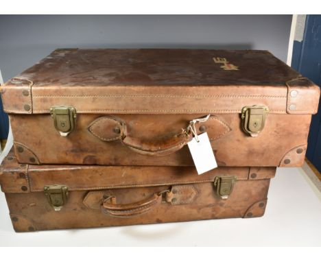 A pair of vintage brown leather suitcases the case with green cloth interirs and measuring 27«in. (69.8cm.) 