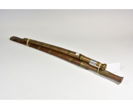 A 19th century Burmese Dha with 21in. (53.3cm.) slightly curved edge square ended blade, engraved with flower heads to end, t