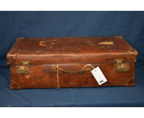 A Gentlemans early 20th century fitted brown leather suitcase the case being appointed with many accessories to include mainl