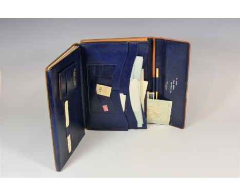 A vintage leather John Pound &amp; Co writing wallet with accessories. 