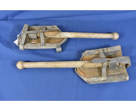 Two World War II German entrenching tools with original leather cradles. (2) 