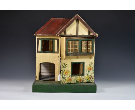 A vintage Triang dolls house No. 60, made circa 1937 and featuring metal framed windows, gabled roof and red tiles a/f. 
