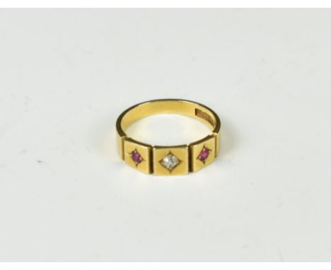 A 18ct gold ruby and diamond three stone ring, size N, 4g.