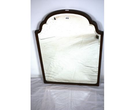 A 1920's carved mahogany mirror with bevelled plate. 