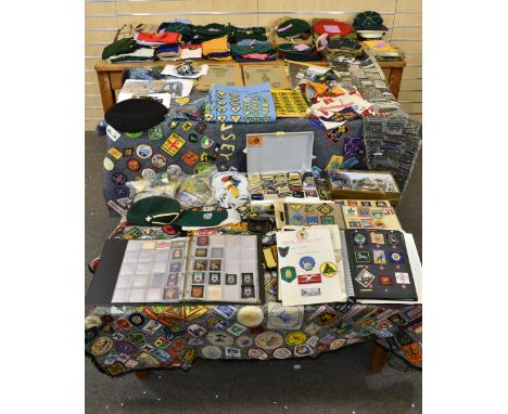 A lifetime's collection of Scouting memorabilia from around the world. Contains two large grey woollen ponchos, a blue sheet 