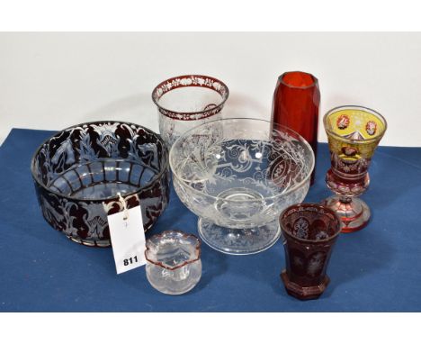 A 19th century Bohemian engraved and ruby flashed glass vase indistinct etched maker's mark to base, beaker form with everted