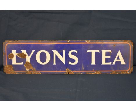 A vintage Lyons Tea enamel sign - advertising interest blue ground, LYONS TEA, 7 x 27in. (17.8 x 68.6cm.), showing rust, fair