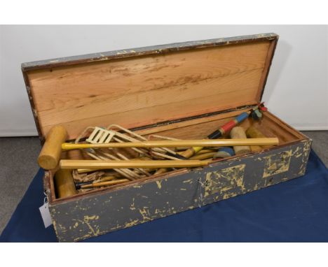 A vintage croquet set in original painted pine box.