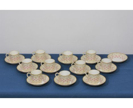 Nymphenburg porcelain coffee cans and saucers twelve settings (one can missing), decorated with roses and gilt trim.